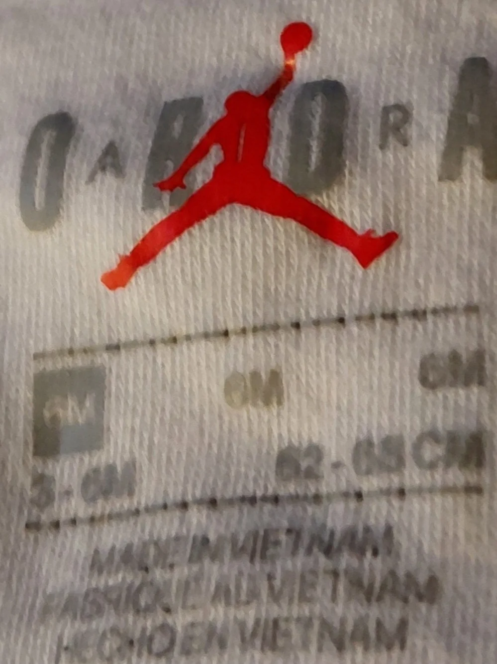 Jordan White Footed One-Piece with Red Trim and Black Logo Print